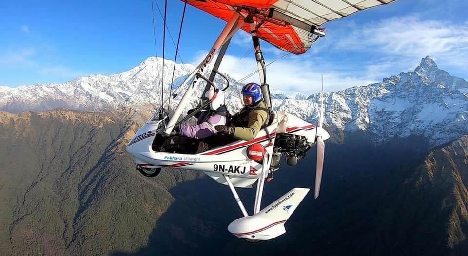 Soar above Pokhara with Mount Machhapuchhre (Fishtail) rising majestically behind you.